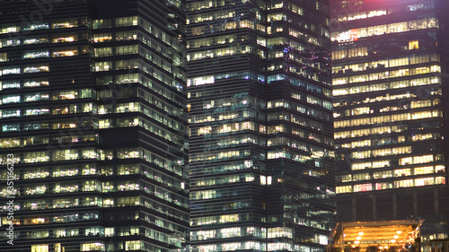 Konstfotografi Modern Office Skyscraper Buildings and Glass Windows at Night