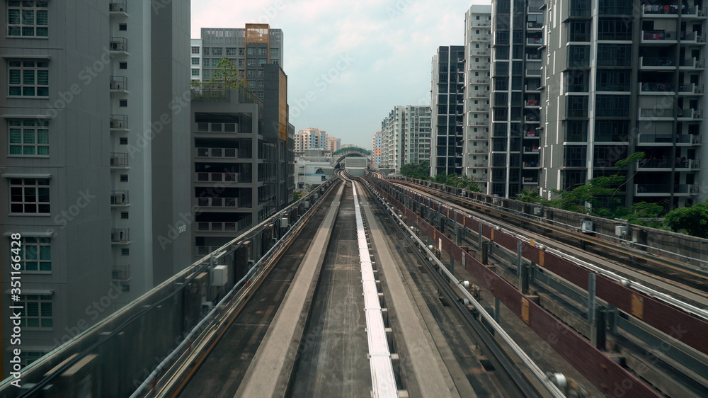 Driverless LRT Train on Elevated Tracks in City of Singapore