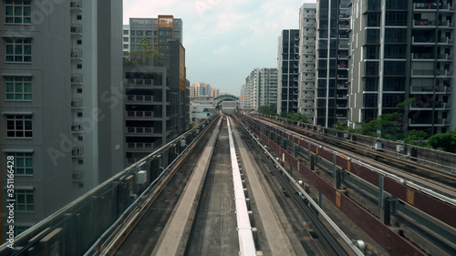 Driverless LRT Train on Elevated Tracks in City of Singapore