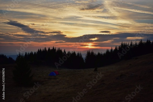 beautiful sunset with colorfully clouds at the mountain. horizon seen from high altitude