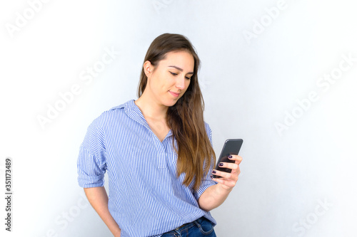 Beatiful young woman using smartphone