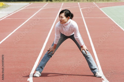 Girl warming up on the track.