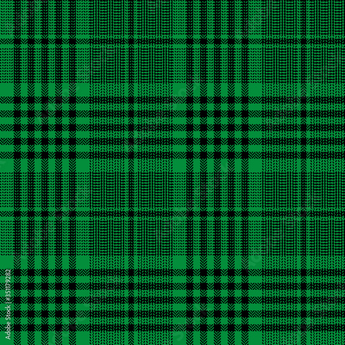 Tartan plaid pattern in green and black. Seamless herringbone glen check plaid graphic for blanket, throw, trousers, jacket, or other modern winter tweed fabric design.