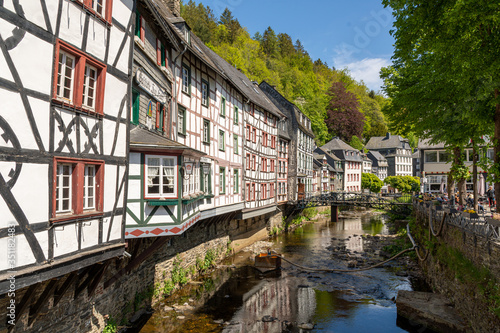 Monschau, Germany - May 17, 2020 Half-timbered houses at the river Rur