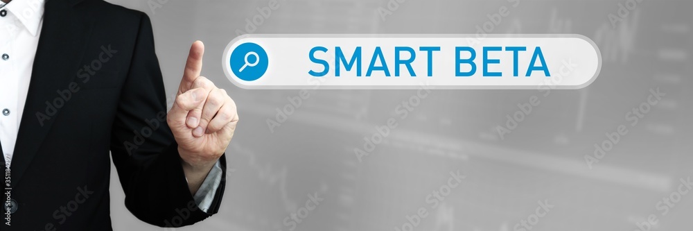 Fototapeta premium Smart Beta. Businessman (Man) in a suit pointing with his finger to a search box. The word is in focus. Blue Background. Business, Finance, Statistics, Analysis, Economy