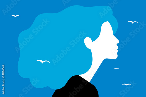 Beautiful young woman with blue hair. Beautiful young woman in the clouds. Blue hair like the sky in which birds fly. The concept of tenderness, reverie, meditation and peace.