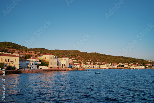 Fototapeta Naklejka Na Ścianę i Meble -  A sunsrise view of the buildings of the beautiful Greek Island.