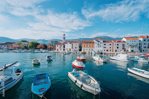 Kastel coast in Dalmatia Croatia. A famous tourist destination on the Adriatic sea. Fishing boats moored in old town harbor.