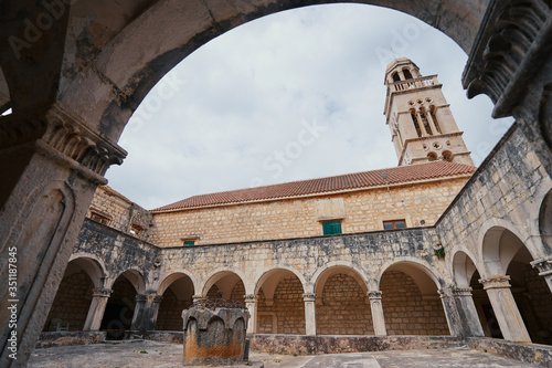 Ancient catholic architecture. The courtyard of  Franciscan Monastery in Hvar  Croatia.