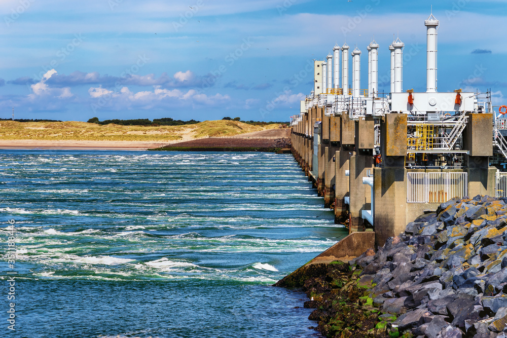 Flood preventing Brouwers dam sluice letting out river water Stock