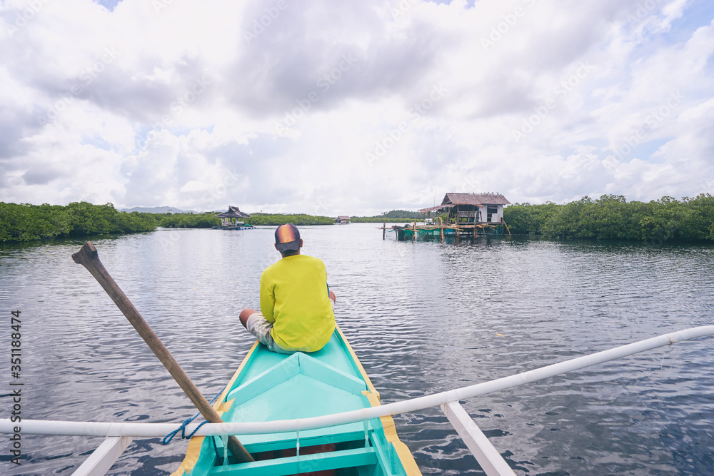 Vacation in Philippines. Sailing the sea on traditional boat.