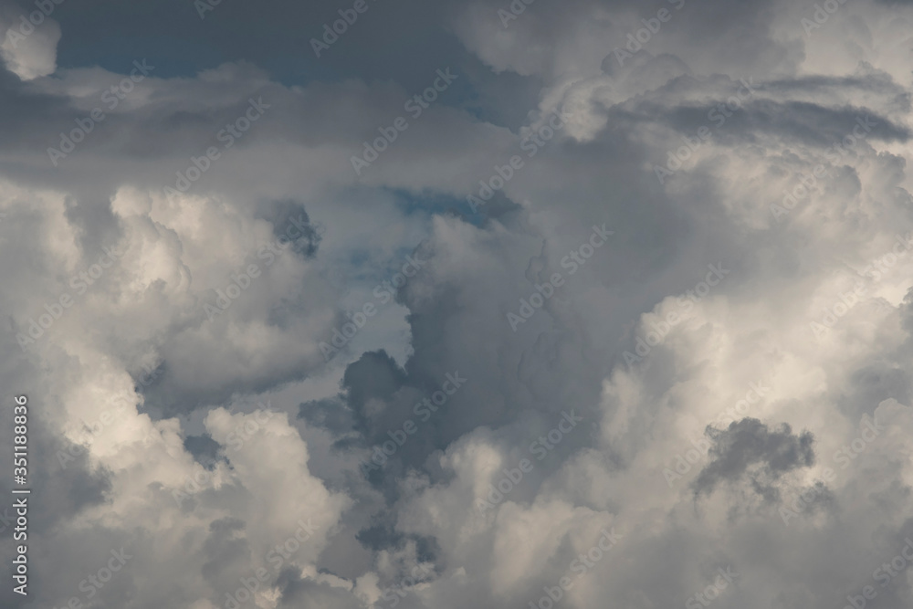 Large white and gray textured clouds.