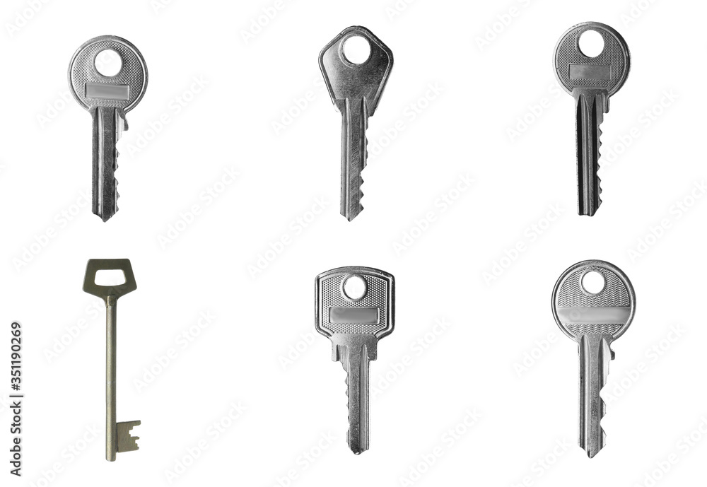 Set of modern steel keys on white background Set of modern steel keys on white background
