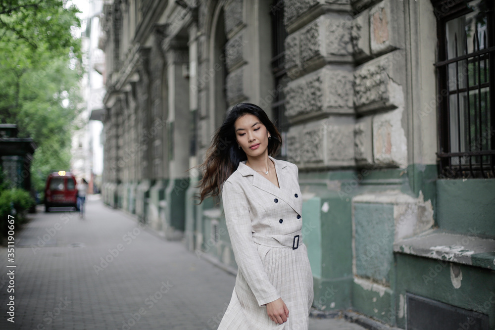 Asian girl is walking in the city