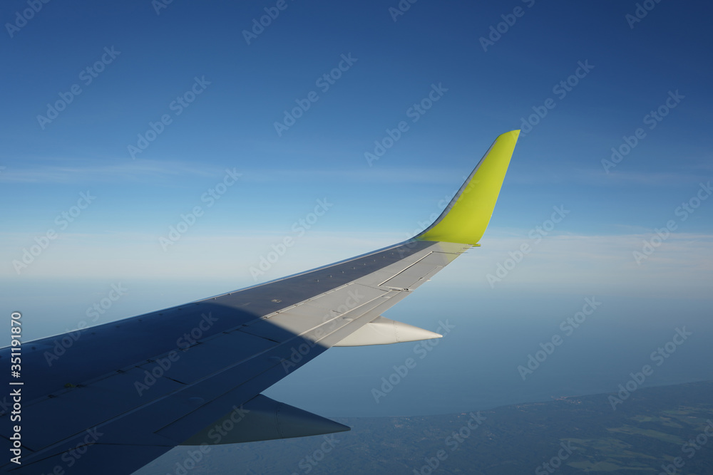 Fototapeta premium Plane wing, view from porthole 