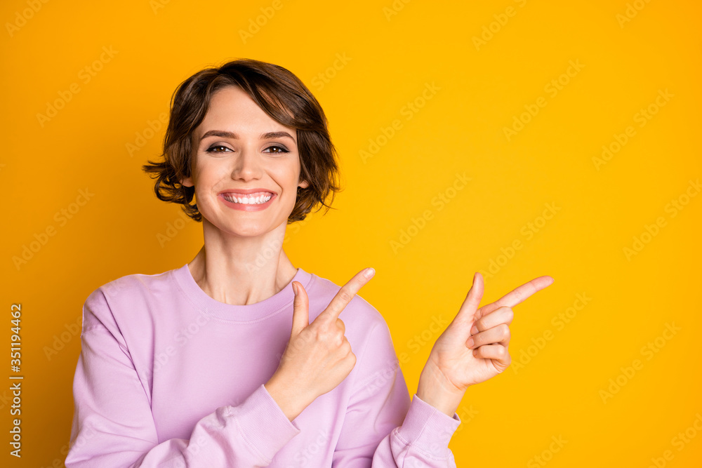 Portrait of positive cheerful girl promoter point index finger copyspace present ads promotion recommend suggest select wear sweater isolated over bright color background Portrait of positive cheerful girl promoter point index finger copyspace present ads promotion recommend suggest select wear sweater isolated over bright color background