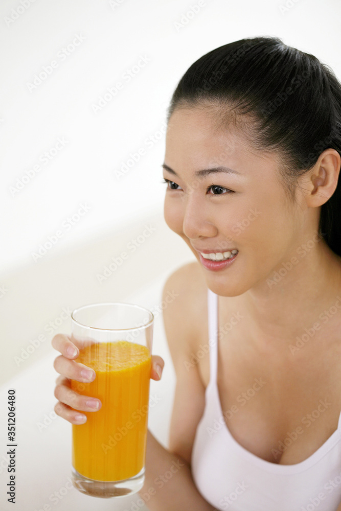 Woman with a glass of orange juice Woman with a glass of orange juice