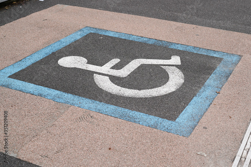 parking space and sign for disabled in city street