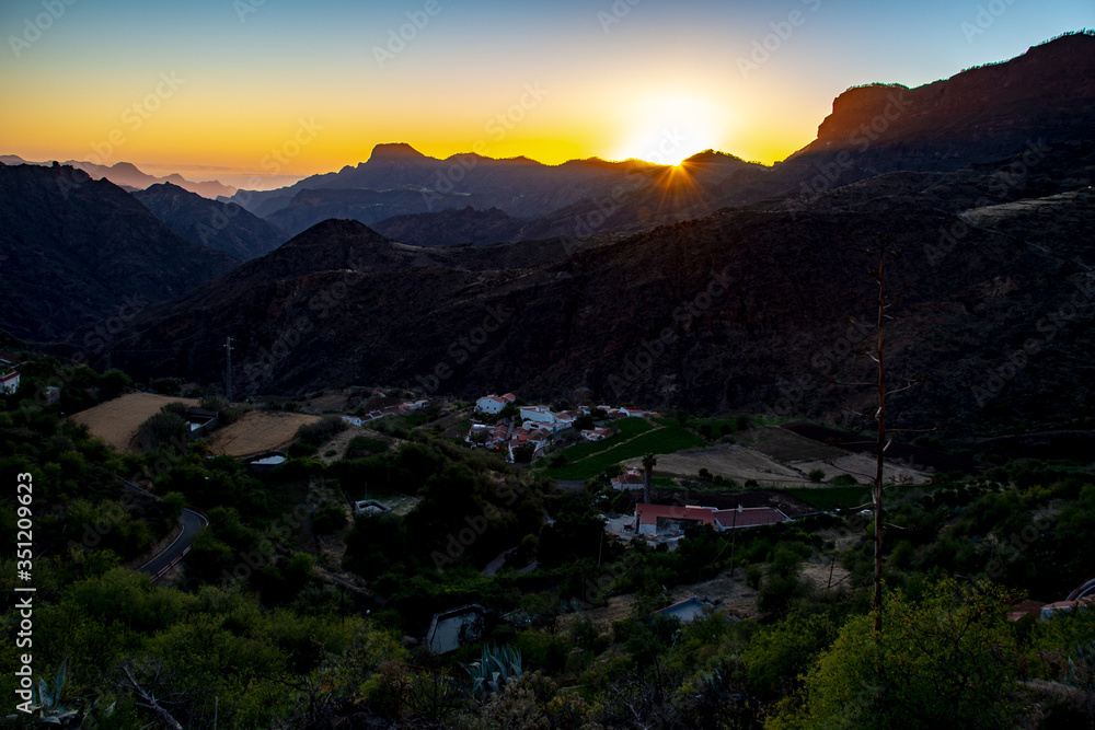 sunset in the canaries on the west side of the island with fog in the background. sunset in the canaries on the west side of the island with fog in the background.