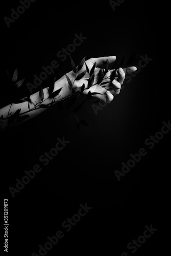 Black and white art fashion surrealistic portrait of beautiful woman,details of body black and white portrait of beautiful girl,fashion and art,portrait with plants and flowers