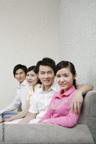 Men and women posing for the camera