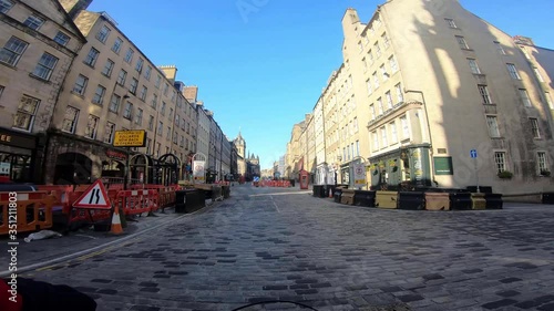 4K Shot.  Deserted Royal Mile / Edinburgh High Street, due to Corona Virus Pandemic.  This street is in Edinburgh's Old Town, normally busy with tourists and shoppers. photo