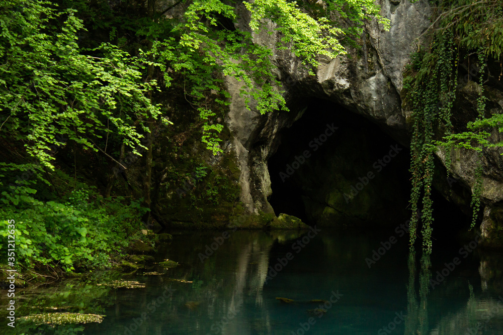 Monument of nature, spring of river Krupaja or Krupajsko vrelo with underwater cave. Beautiful natural oasis and tourist attraction in Eastern Serbia. Monument of nature, spring of river Krupaja or Krupajsko vrelo with underwater cave. Beautiful natural oasis and tourist attraction in Eastern Serbia.