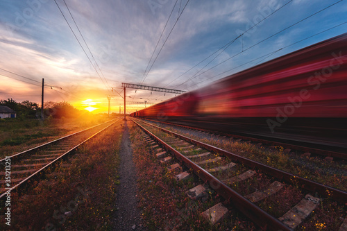 freight, passenger train moves with speed by rail