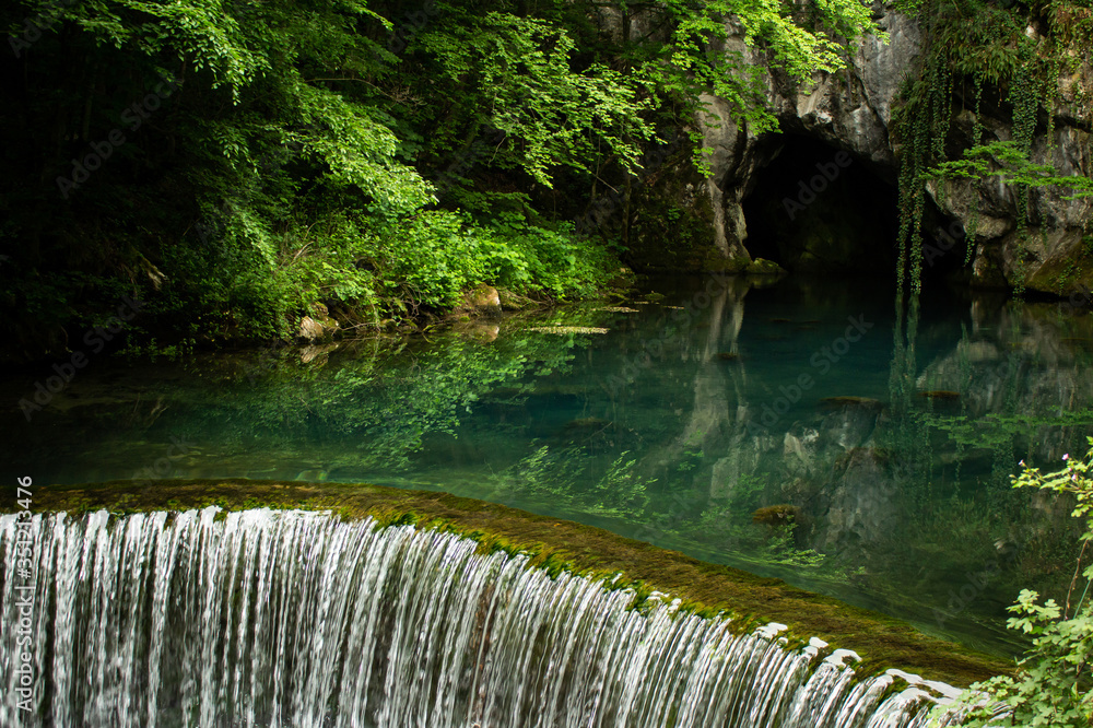 Naklejka premium Monument of nature, spring of river Krupaja or Krupajsko vrelo with underwater cave. Beautiful natural oasis and tourist attraction in Easte