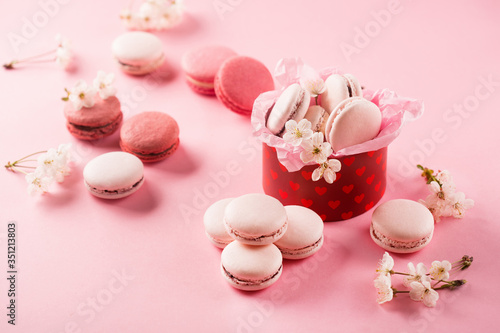 Pink macaroons in red gift box