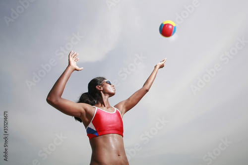 Woman playing beach volleyball © ImageHit