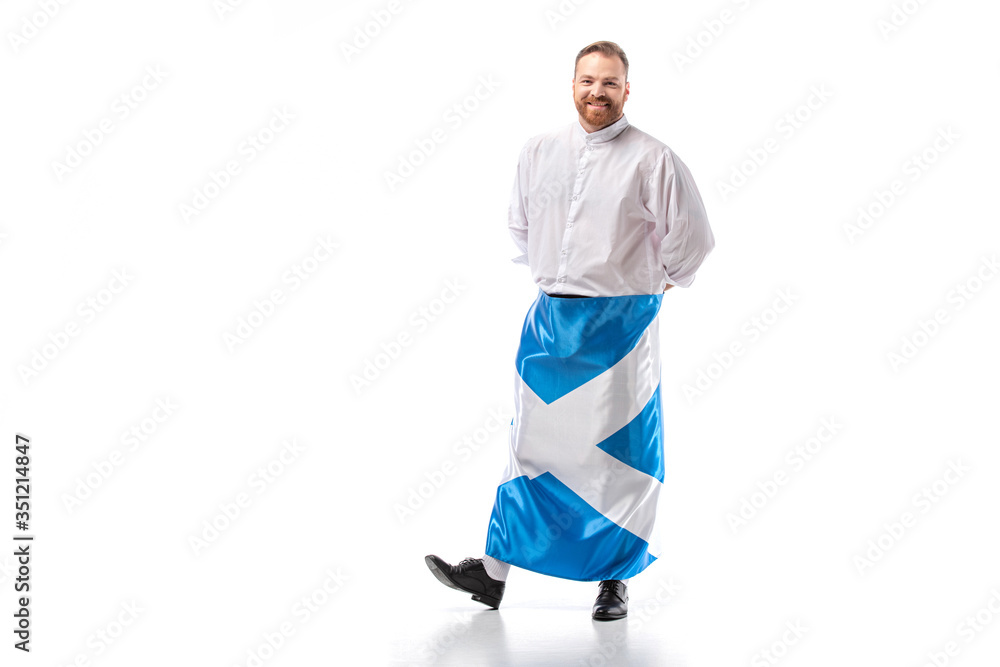 smiling Scottish redhead man with flag of Scotland on white background smiling Scottish redhead man with flag of Scotland on white background