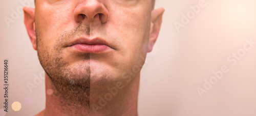 Closeup of man with beard on half of the face on grey background. Portrait of a handsome man with a shaved half his face.