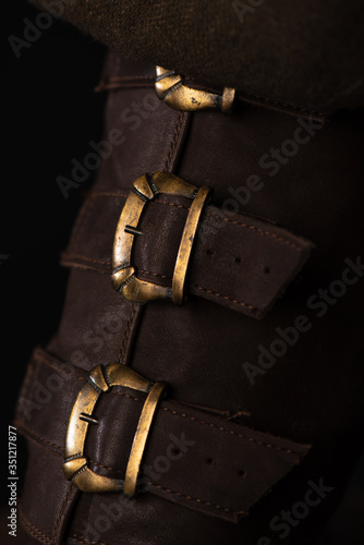 close up view of medieval Scottish brown leather shoes with buckles
