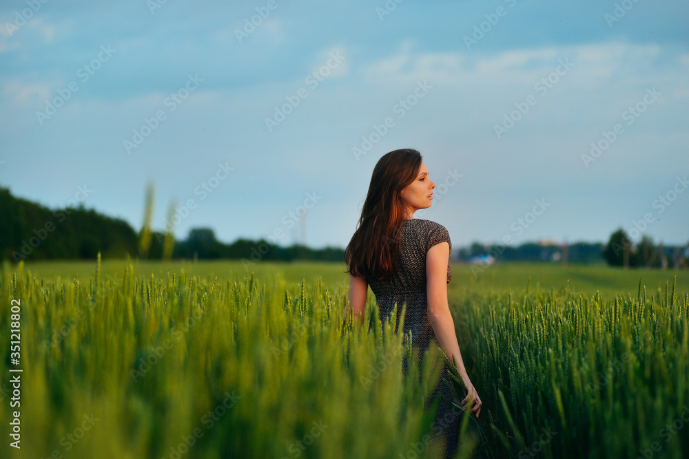 young beautiful woman at summer meadow flowers young beautiful woman at summer meadow flowers