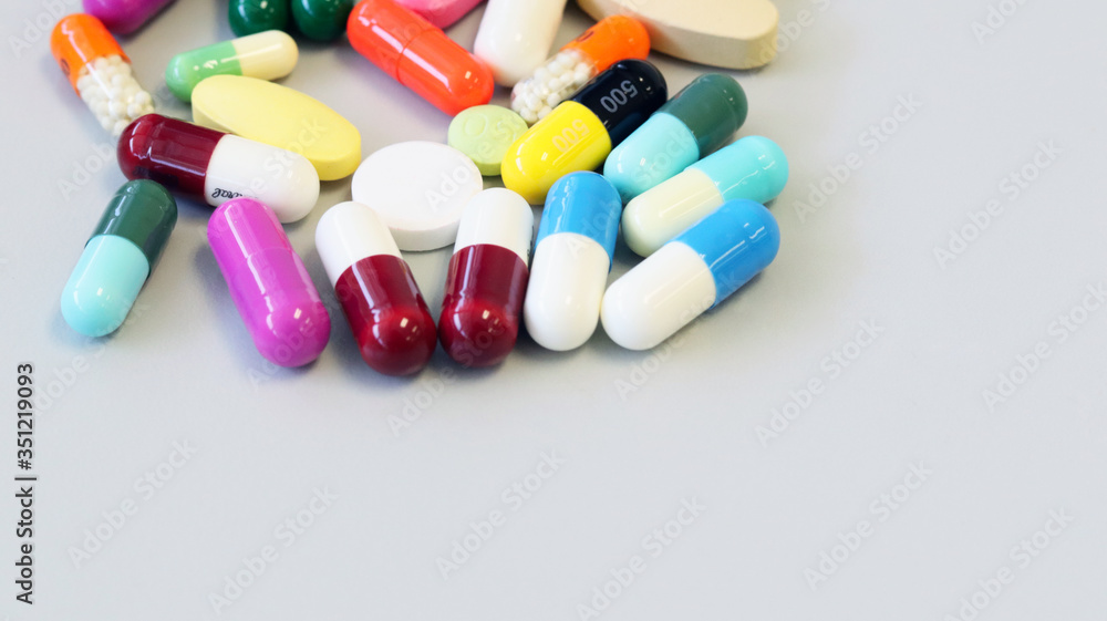 Colorful tablets, pills and capsules medicine using for treatment and cure the disease or sickness. Drug prescription using for medication in medical clinic, pharmacy Pharmaceutical service concept.