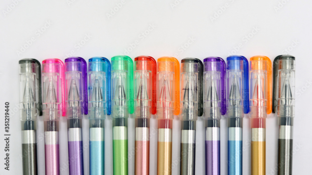 Close up colorful pens rainbow isolated in white background has copy space for text, using for studying in school class room, back to school template learning concept, can use as PowerPoint template. Close up colorful pens rainbow isolated in white background has copy space for text, using for studying in school class room, back to school template learning concept, can use as PowerPoint template.