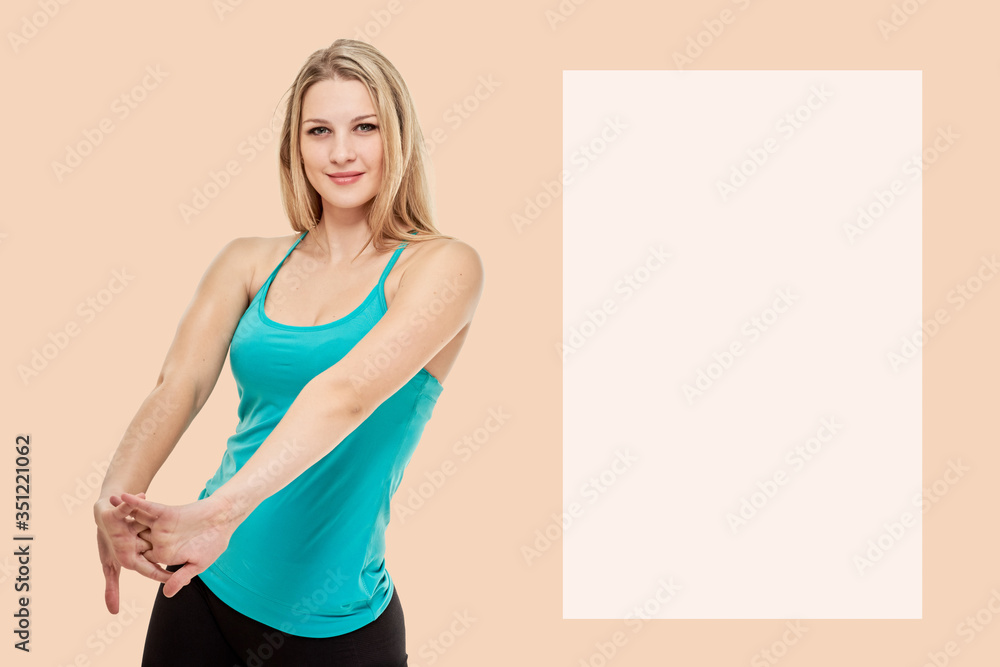 Portrait of attractive slim healthy woman warming-up on peach background with space for text Portrait of attractive slim healthy woman warming-up on peach background with space for text