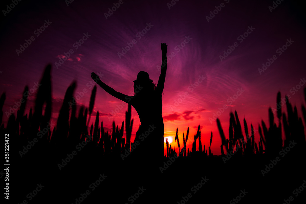 portrait of a beautiful jumping girl in hat at sunset portrait of a beautiful jumping girl in hat at sunset