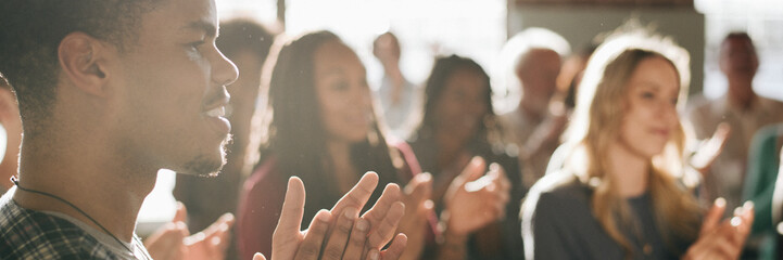 Diverse people clapping after a session