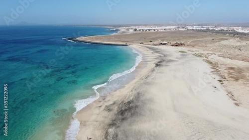Wallpaper Mural Drone view from above to Ponta Preta beach in Cape Verde, with deep blue water and some hotels in the background Torontodigital.ca