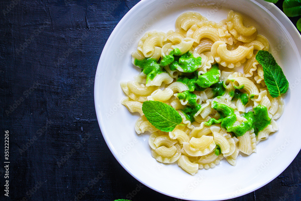 pasta creste di galli green sauce mint pesto Menu concept healthy eating. food background top view copy space for text healthy eating pasta creste di galli green sauce mint pesto Menu concept healthy eating. food background top view copy space for text healthy eating