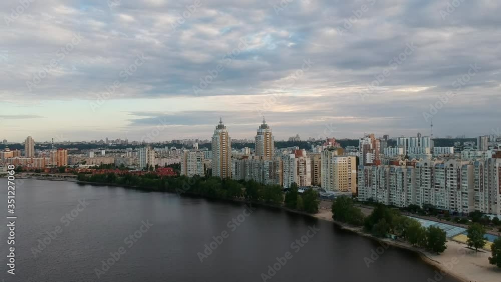 Aerial photography. Obolonskaya embankment in the spring in Kiev. Many houses built along the Dnieper Bay. Drone. Aerial photography. Obolonskaya embankment in the spring in Kiev. Many houses built along the Dnieper Bay. Drone.