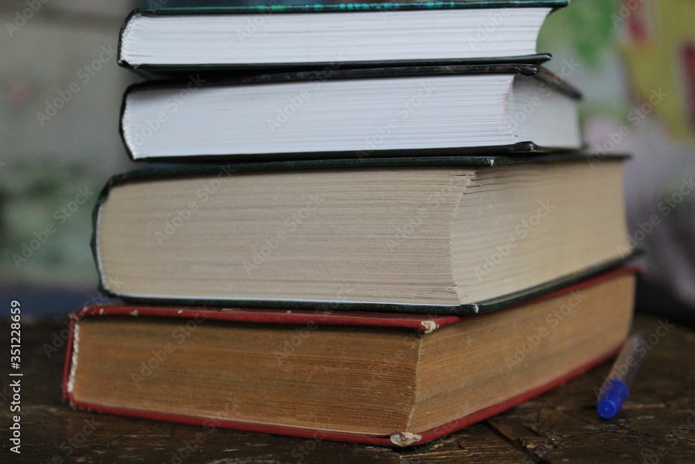 a stack of old and new books on the table a stack of old and new books on the table