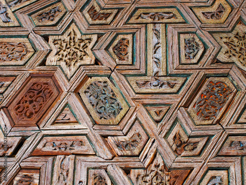 Intricate wood pattern on the wall in the form of geometric shapes.
Sevilla, Spain. August 2012.
