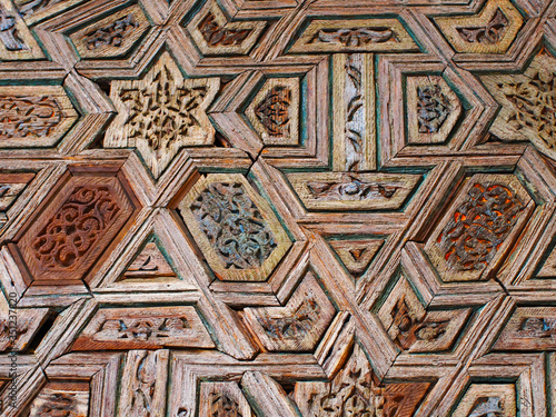 Intricate wood pattern on the wall in the form of geometric shapes. Sevilla, Spain. August 2012.