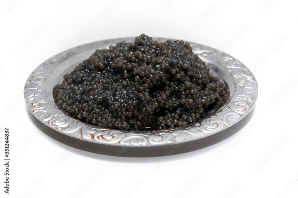 black caviar on a beautiful silver plate black caviar on a beautiful silver plate