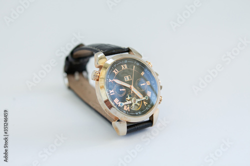 men's gold watch with a leather strap