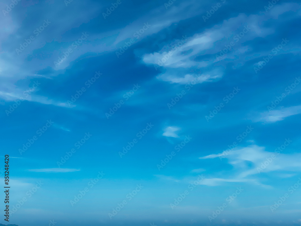 Blue sky with white clouds background. Clear sunny day