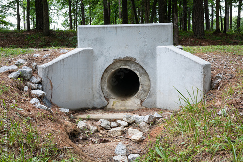 Formed concrete headwall for pipe, culvert rainwater drainage, erosion management, horizontal aspect photo